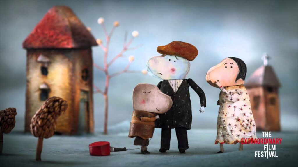 Fotograma del cortometraje animado La petite casserole d’Anatole donde el niño arrastra su pequeña cacerola roja.