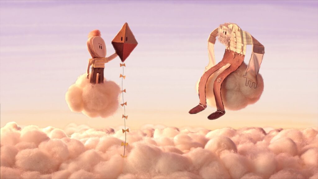Escena del cortometraje stop motion The Kite con un niño y su abuelo volando una cometa.